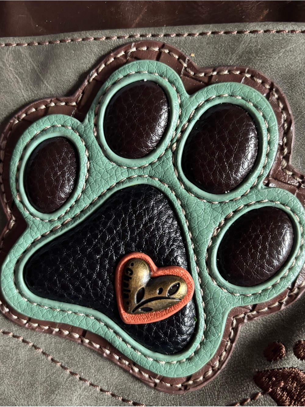 Chala Grey and Brown Paw Print Crossbody Bag - Picture 2 of 16
